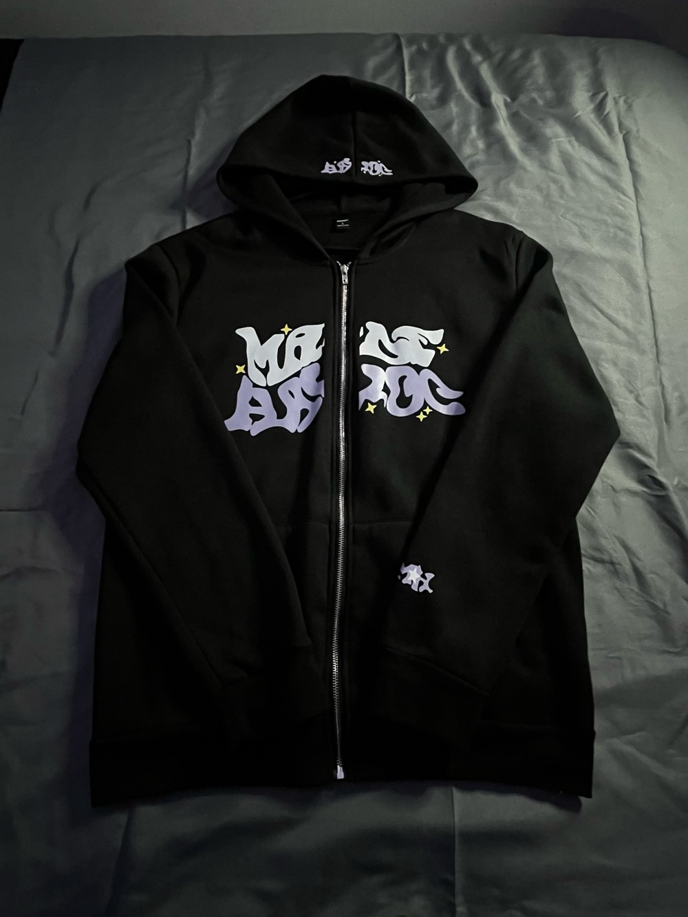 Black Zip-Up Hoodie with Lavender Graphic and Star Accents